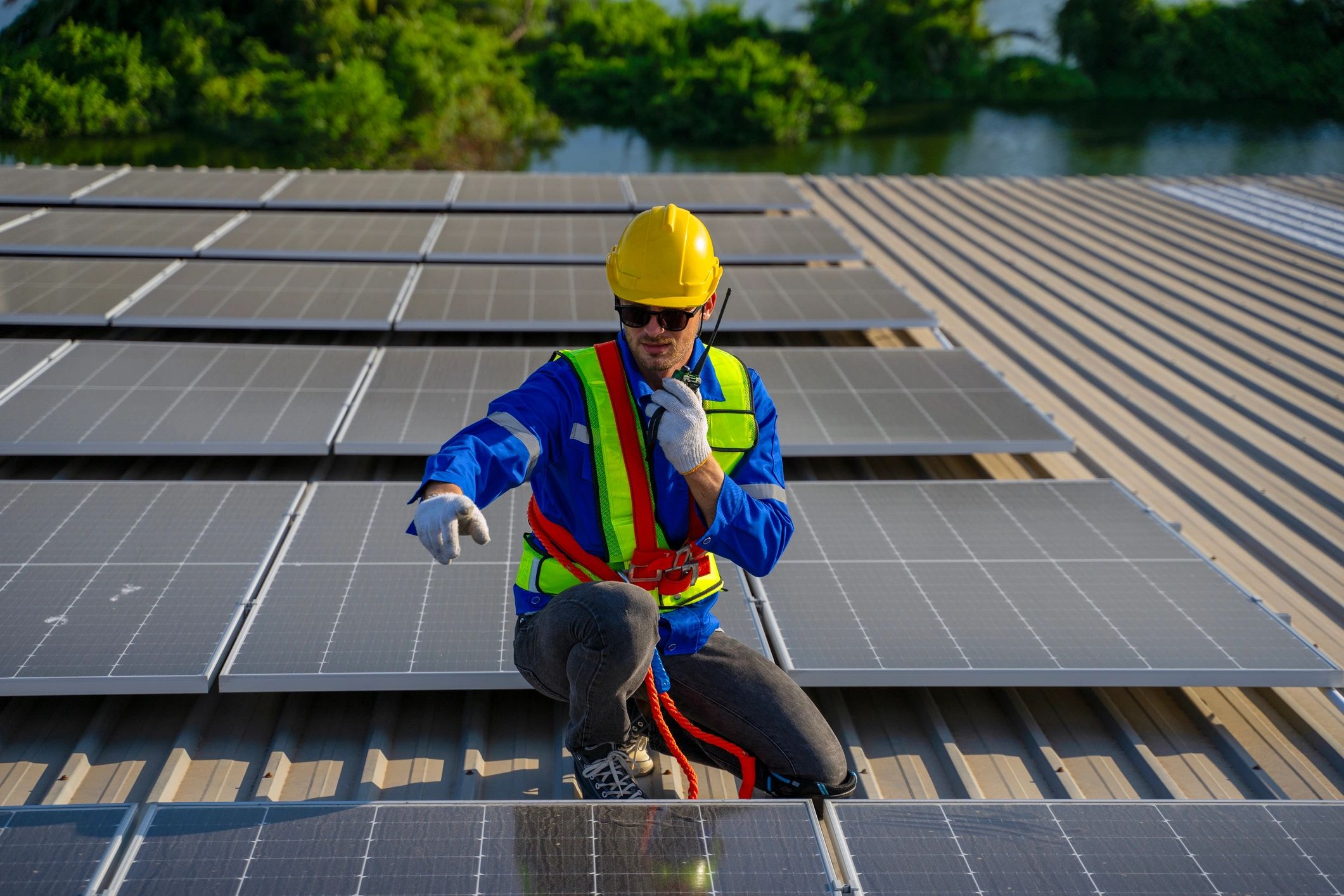 Electrical technician checking rooftop equipment